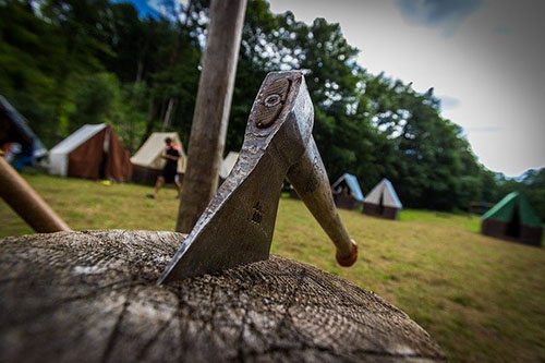 Camp site with camping hatchet