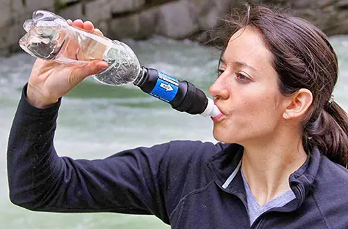 Drinking from a camping water filter